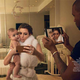 Illustration for article titled Spot Everything Wrong With This Photo of Kanye Taking an iPad Pic